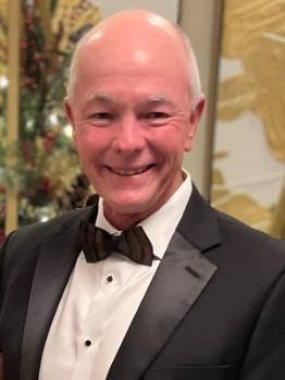 man wearing a black bowtie and tuxedo