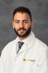 White coat portrait of Khalid Shaqdan, MB.BCh