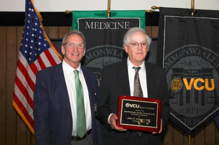 Dr. Grizzard receiving award