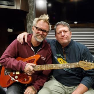Anders Osborne with his new guitar next to Mike Aronson