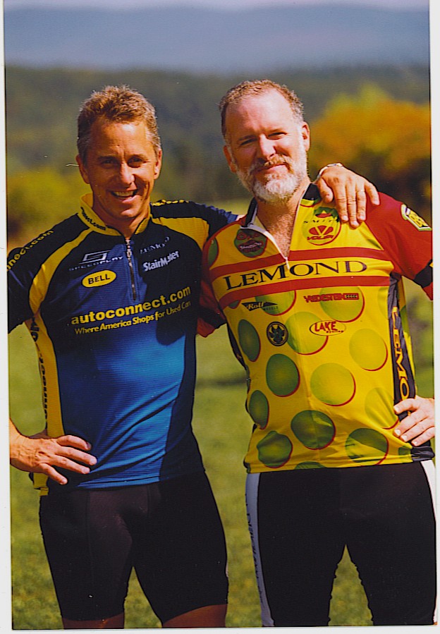Jeff Blinder standing to the right of Cyclist Greg LeMond