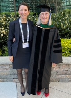 Doctor Jane Clayton standing to the right of her adult daughter at the F A C R ceremony