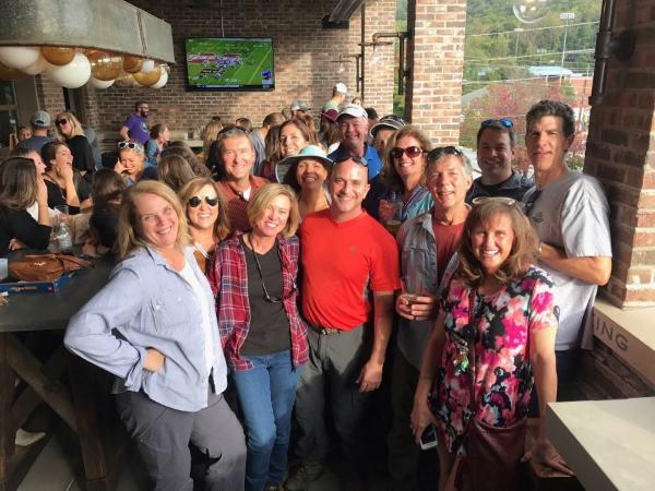 Large group of radiology residency program alumni standing together in a restaurant